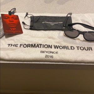VIP Pass, sunglasses, and towel